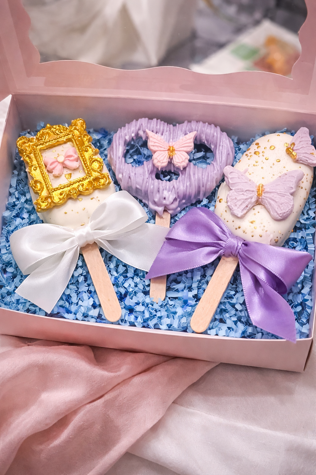 Two Cakesicles and pretzel box